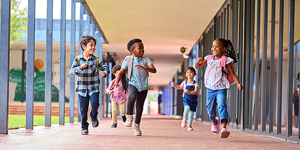 students skipping in the hall