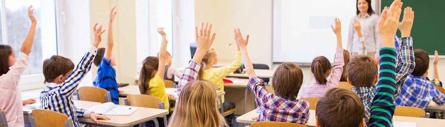 children raising hands