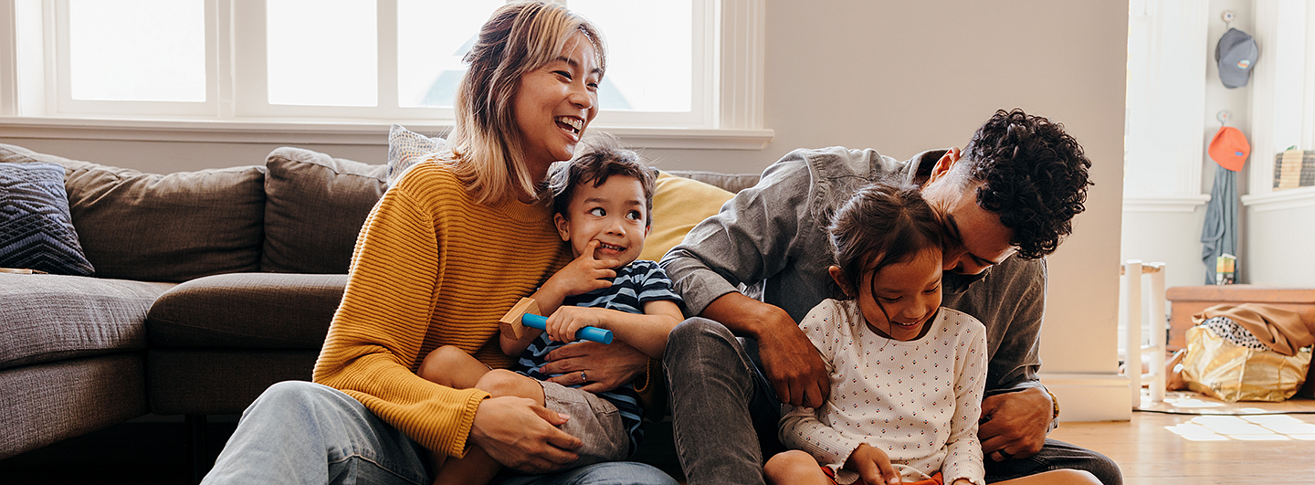 family of four playing a game together