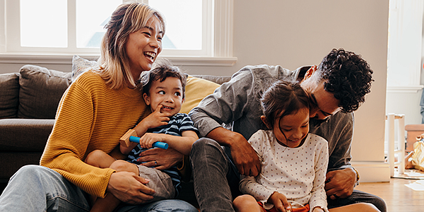 family of four playing a game together