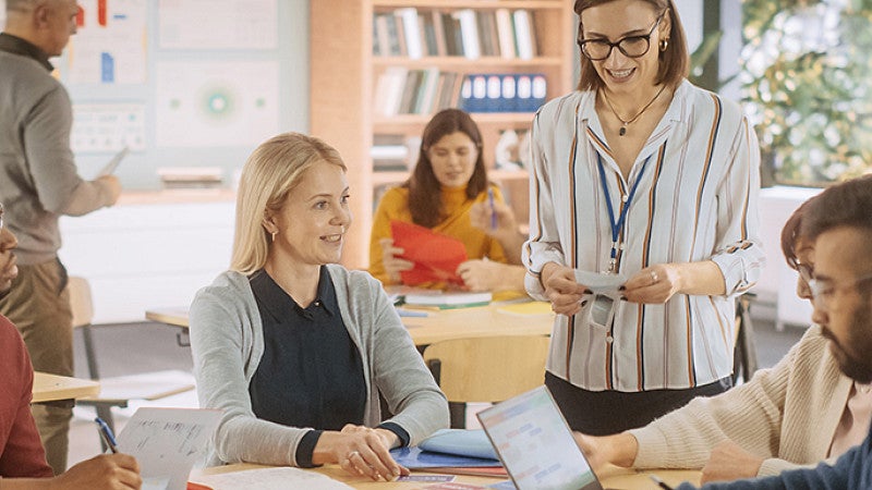 Teachers sitting together at a meeting 